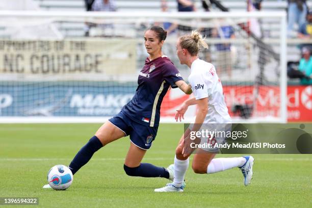 Diana Ordonez of the North Carolina Courage plays the ball away from Julia Roddar of the Washington Spirit during the NWSL Challenge Cup Final...
