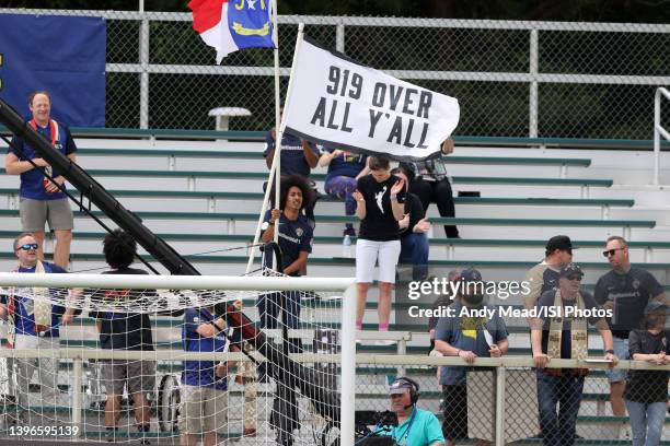 North Carolina Courage fans waive a banner reading "919 Over All Y'All" during the NWSL Challenge Cup Final between Washington Spirit and North...