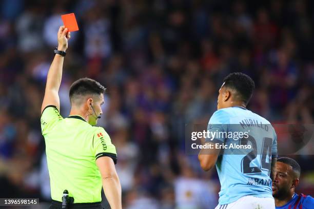 Match referee shows a red card to Jeison Murillo of Celta de Vigo during the La Liga Santader match between FC Barcelona and RC Celta de Vigo