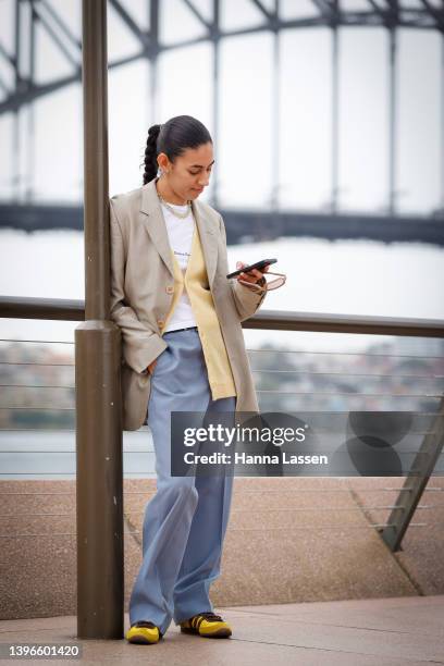 Teanne Vickers wearing Vividness Ramsey top, Swarovski necklace, Lacoste cardigan, Adidas shoes, Kenzo blazer, Miu Miu sunnies at Afterpay Australian...