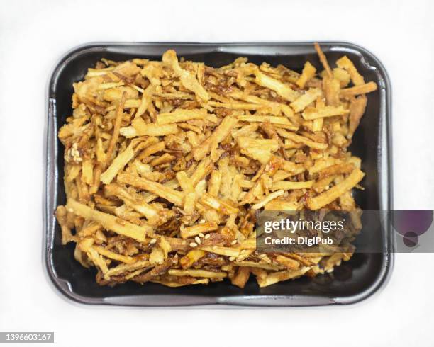 burdock root, shredded and fried, crispy and sweet - greater burdock stock pictures, royalty-free photos & images