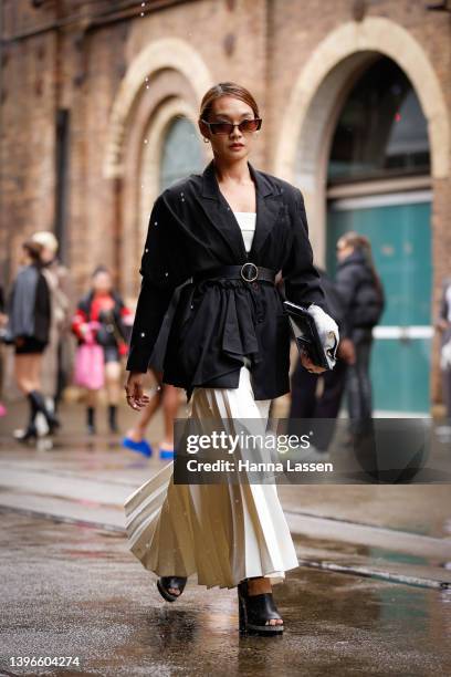 Cai wearing Dion lee dress in white, Yen club Black vintage blazer, Valentino sunglasses, Glowmesh bag, Stuart weitzman heels at Afterpay Australian...