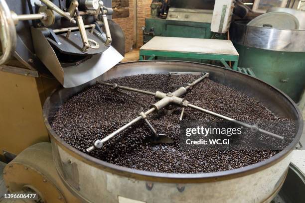 machine roasted coffee beans - coffee processing stock pictures, royalty-free photos & images