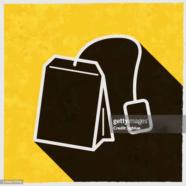 tea bag. icon with long shadow on textured yellow background - tea stain texture stock illustrations