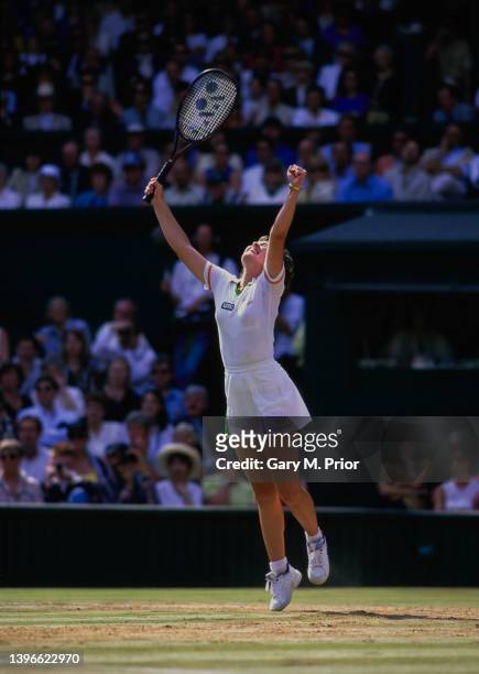 Martina Hingis from Switzerland jumps in the air to celebrate winning the Women's Singles Final match on Centre Court against Jana Novotná at the...