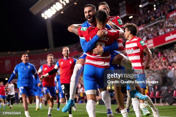 Luis Suarez of Granada CF celebrates with Maxime Gonalons after scoring his team's second goal which was later disallowed during the La Liga...