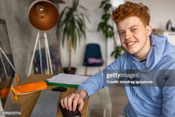 portrait of caucasian teenage boy, a high school student - redhead boy stock pictures, royalty-free photos & images