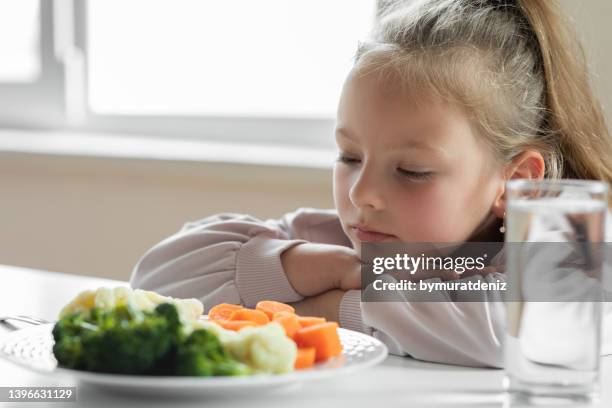 girl does not like to eat vegetables - hate broccoli stock pictures, royalty-free photos & images