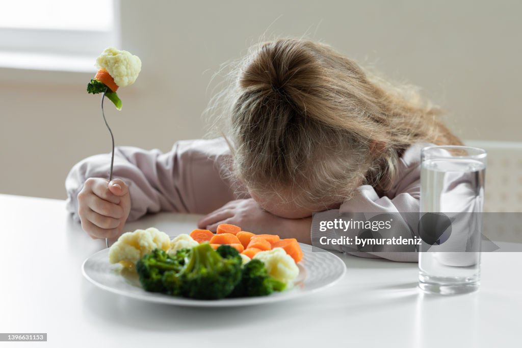Girl does not like to eat vegetables
