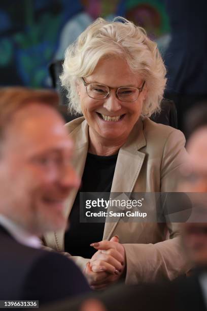 German Defense Minister Christine Lambrecht chats with colleagues prior to the weekly federal government cabinet meeting on May 11, 2022 in Berlin,...