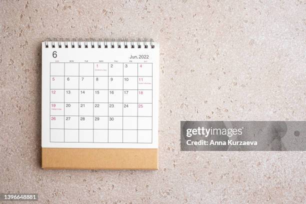 june 2022 desk calendar on concrete background, top view. copy space. - june 1 stock pictures, royalty-free photos & images