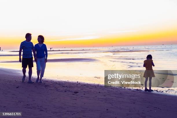 happy old man walking on the beach - the old man and the sea stock pictures, royalty-free photos & images