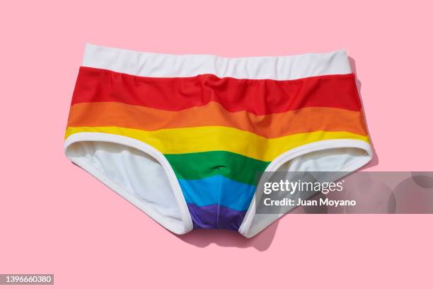 swimsuit patterned with the rainbow flag - slip stock-fotos und bilder