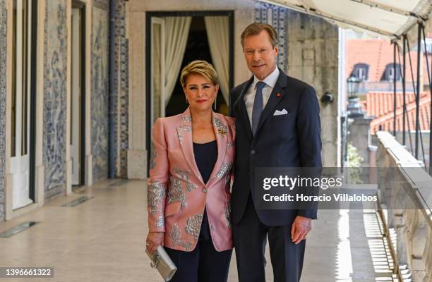 Henri, Grand Duke of Luxembourg, and Maria Teresa, Grand Duchess of Luxembourg, pose for pictures at the veranda after their meeting with Portuguese...