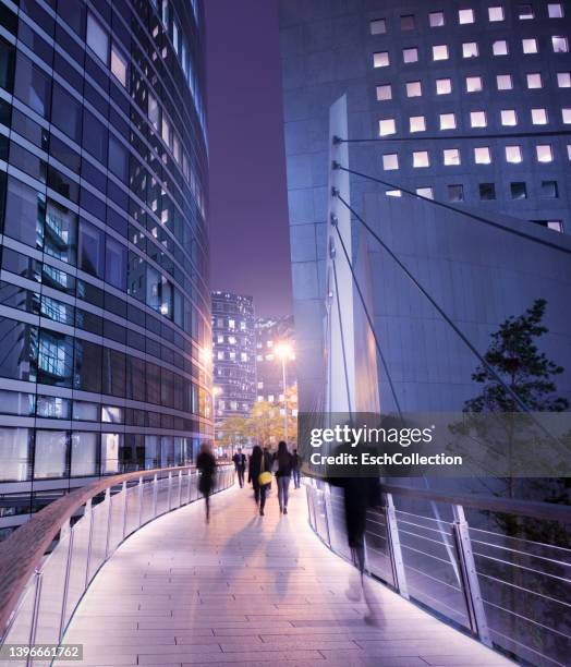 business people using walkway at business district in paris - paris financial district stock pictures, royalty-free photos & images