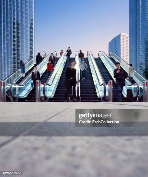 morning commuters using a six lane escalator to get to their destination - white collar worker dawn light stock pictures, royalty-free photos & images