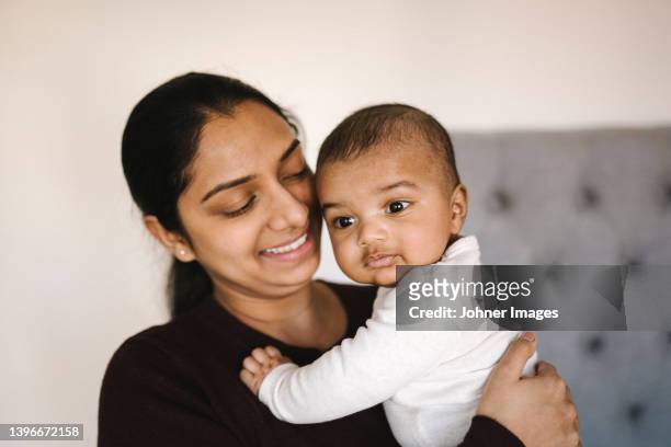 mother with baby - indian mother stock pictures, royalty-free photos & images