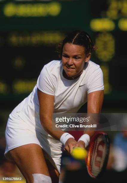 Lindsay Davenport from the United States plays a double handed forehand return to Kim Clijsters of Belgium during their Women's Singles Quarter Final...