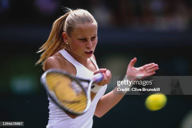 Jelena Dokic of Yugoslavia keeps her eyes on the tennis ball as she plays a forehand return to Nathalie Dechy of France during their Women's Singles...