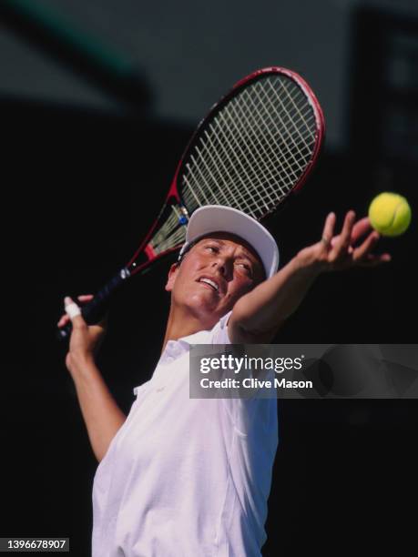 Jo Durie from Great Britain prepares to serve to Jana Novotná of the Czech Republic during their Women's Singles Second Round match at the Wimbledon...