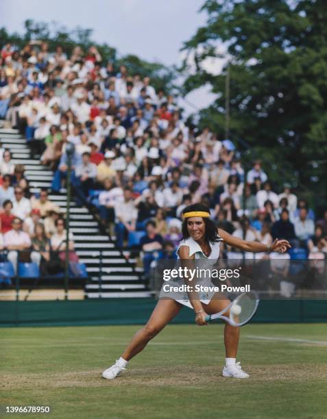 Rosie Casals of the United States plays a backhand return to Kerry Ried and Wendy Turnbull of Australia during their Women's Doubles match during the...