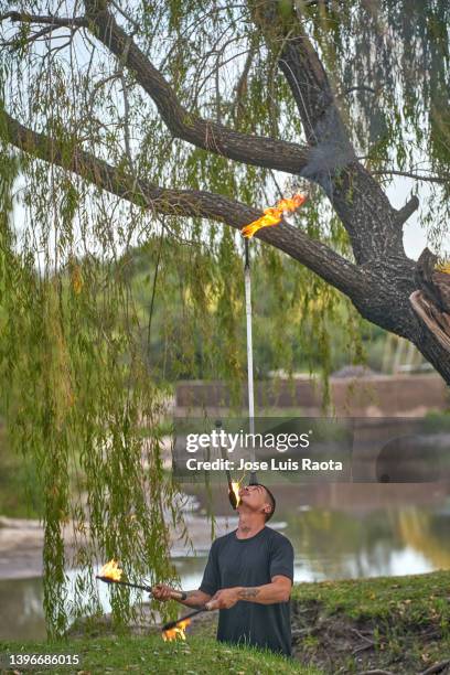 fire show in the park - street performer stock pictures, royalty-free photos & images