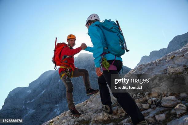 helping hand in the mountains - slovenia mountains stock pictures, royalty-free photos & images