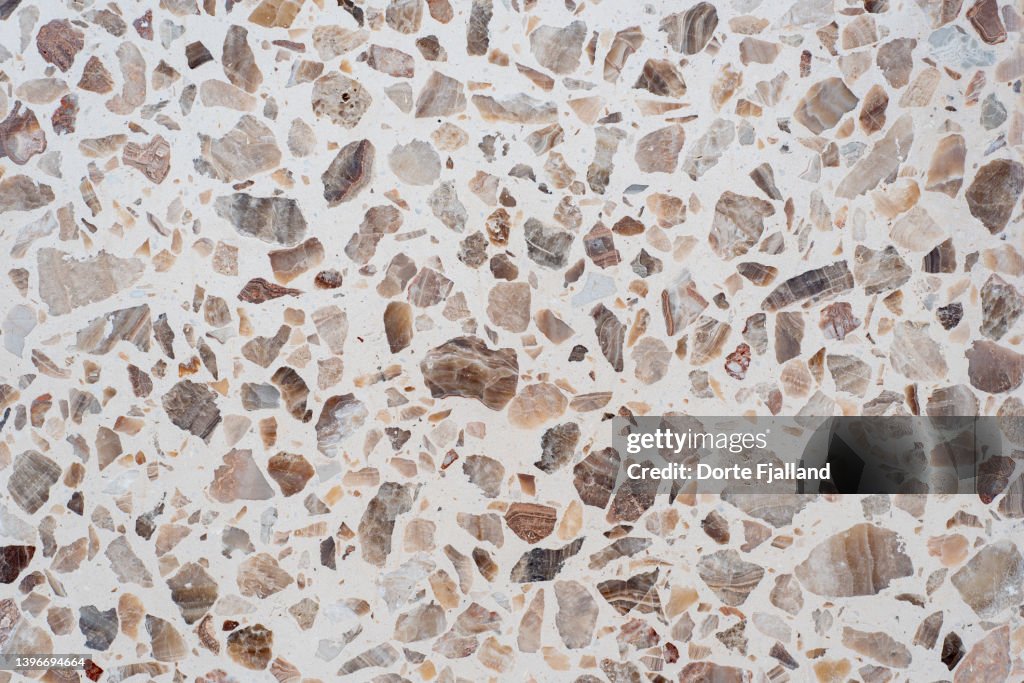Closeup of brown and beige terrazzo tile