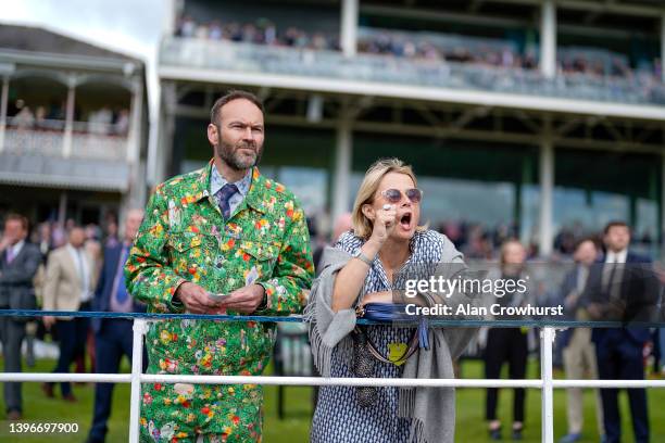 Racegoers watch the action at York Racecourse on May 11, 2022 in York, England.