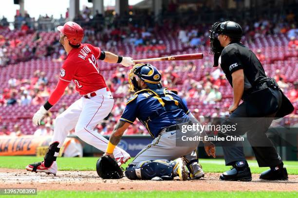 Tyler Naquin of the Cincinnati Reds hits a two RBI triple in the first inning during a game against the Milwaukee Brewers at Great American Ball Park...