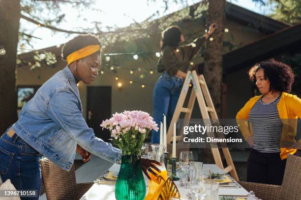 tighten up the decoration for an outdoor event - party preparation stock pictures, royalty-free photos & images