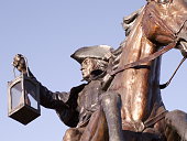 A statue of Paul revere on a horse