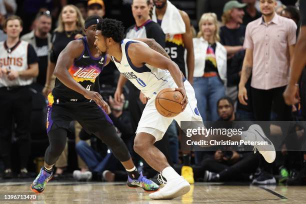 Sterling Brown of the Dallas Mavericks drives the ball past Aaron Holiday of the Phoenix Suns during the second half of Game Five of the Western...