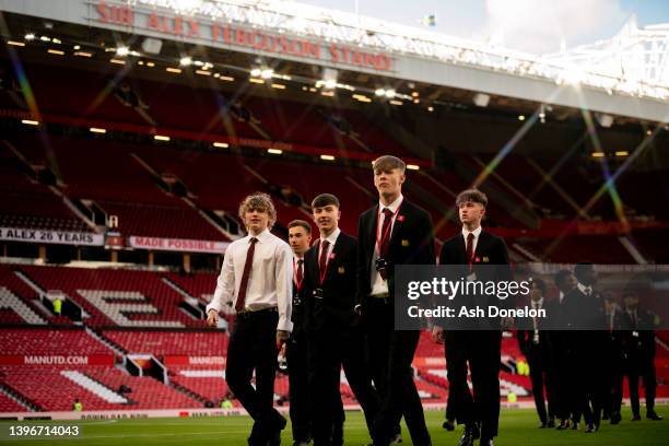 Isak Hansen-Aaroen, Charlie McNeill, Sam Mather of Manchester United U18s arrives ahead of the FA Youth Cup Final between Manchester United U18s and...