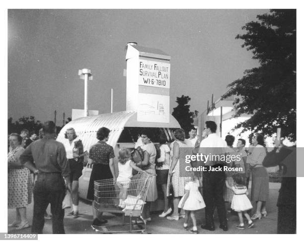 Outside Shop-A-Rama, also known as Levittown Shopping Center , potential customers inspect a demonstration fallout shelter, Levittown, Pennsylvania,...