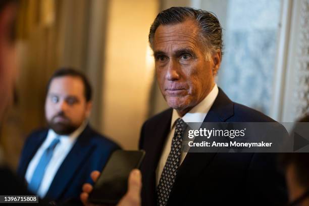 Sen. Mitt Romney speaks to reporters outside of the Senate Chambers during a series of votes in the U.S. Capitol Building on May 11, 2022 in...