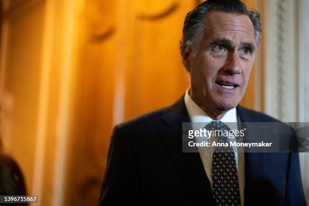 Sen. Mitt Romney speaks to reporters outside of the Senate Chambers during a series of votes in the U.S. Capitol Building on May 11, 2022 in...
