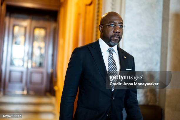 Sen. Raphael Warnock walks out of the Senate Chambers during a series of votes in the U.S. Capitol Building on May 11, 2022 in Washington, DC. Later...