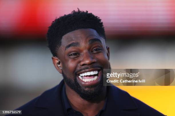 Former Footballer and TV Presenter, Micah Richards smiles prior to the Premier League match between Wolverhampton Wanderers and Manchester City at...