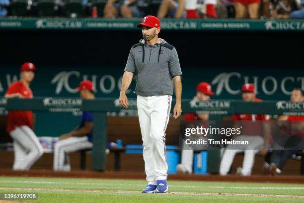 Chris Woodward of the Texas Rangers walks on the field in the game against the Kansas City Royals at Globe Life Field on May 10, 2022 in Arlington,...