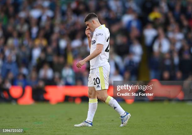 Daniel James of Leeds United looks dejected after being shown a red card by Match Referee, Anthony Taylor following a foul on Mateo Kovacic of...