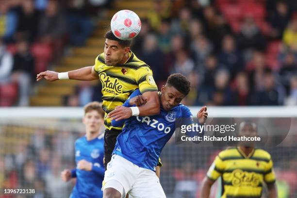 Adam Masina of Watford FC wins a header whilst under pressure from Demarai Gray of Everton during the Premier League match between Watford and...