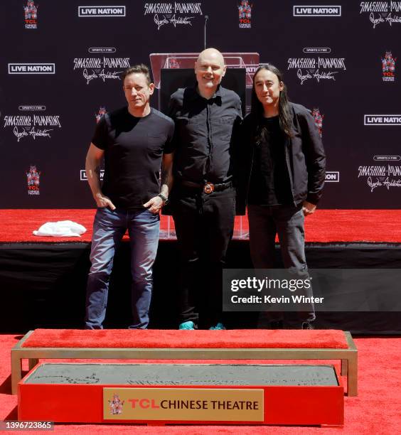 Jimmy Chamberlin, Billy Corgan, and Jeff Schroeder of The Smashing Pumpkins attend the Hand and Footprint Ceremony Honoring The Smashing Pumpkins at...