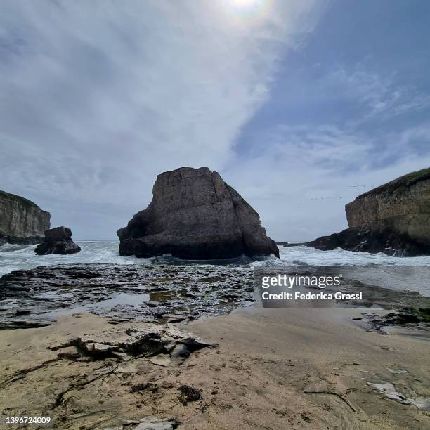 square-crop view of shark fin cove, davenport, california - davenport stock pictures, royalty-free photos & images