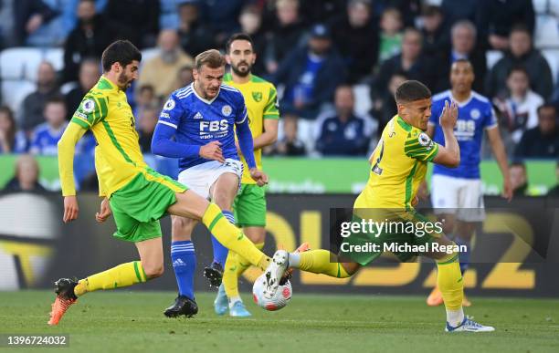 Kiernan Dewsbury-Hall of Leicester City has a shot blocked by Pierre Lees Melou and Max Aarons of Norwich City during the Premier League match...