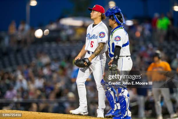 Pitcher Kai-Wei Lin and catcher Juan Centeno of the Amarillo Sod Poodles talk on the mound during the game against the Midland RockHounds at...