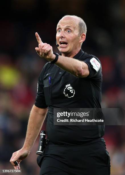 Referee, Mike Dean reacts during the Premier League match between Watford and Everton at Vicarage Road on May 11, 2022 in Watford, England.