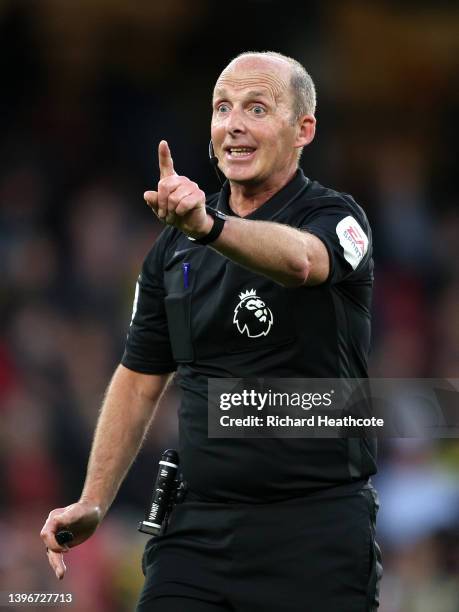 Referee, Mike Dean reacts during the Premier League match between Watford and Everton at Vicarage Road on May 11, 2022 in Watford, England.