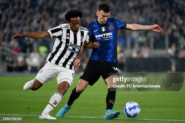 Ivan Perisic of FC Internazionale is challenged by Juan Cuadrado of Juventus during the Coppa Italia Final match between Juventus and FC...