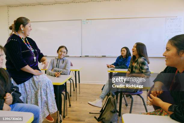 high school teacher and students in a school classroom - north american tribal culture 個照片及圖片檔